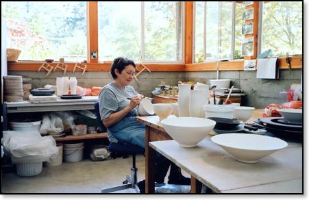Judi Dyelle carving a bowl.